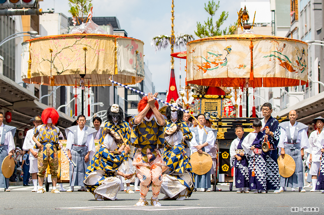 People pulling floats with gorgeous decoration