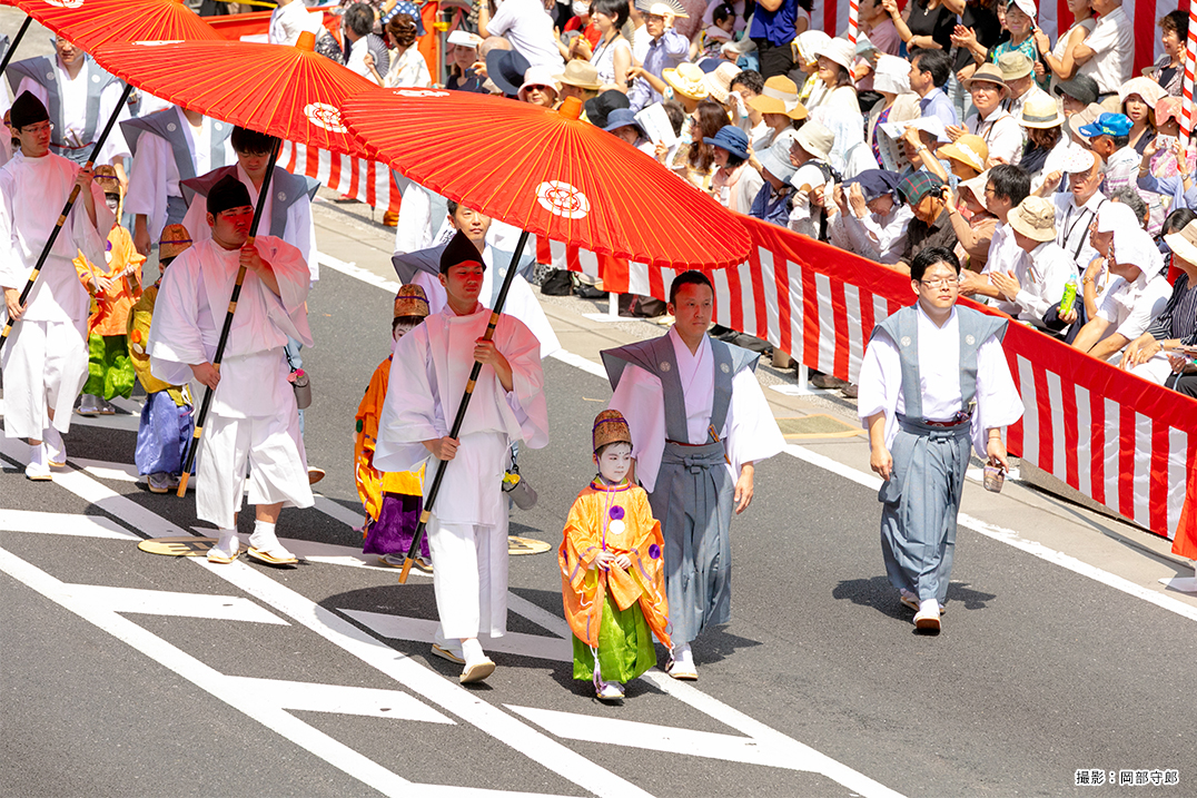 People pulling floats with gorgeous decoration