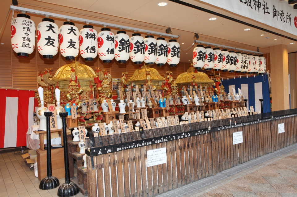 Mikoshi (portable shrines) carrying deities of Yasaka jinja leave the shrine for Otabisho in the downtown of Kyoto. 